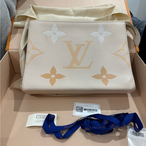 LOUIS VUITTON Creme Monogram Empreinte Leather Pool Poche Toilette 26 Pouch - Picture 4 of 7